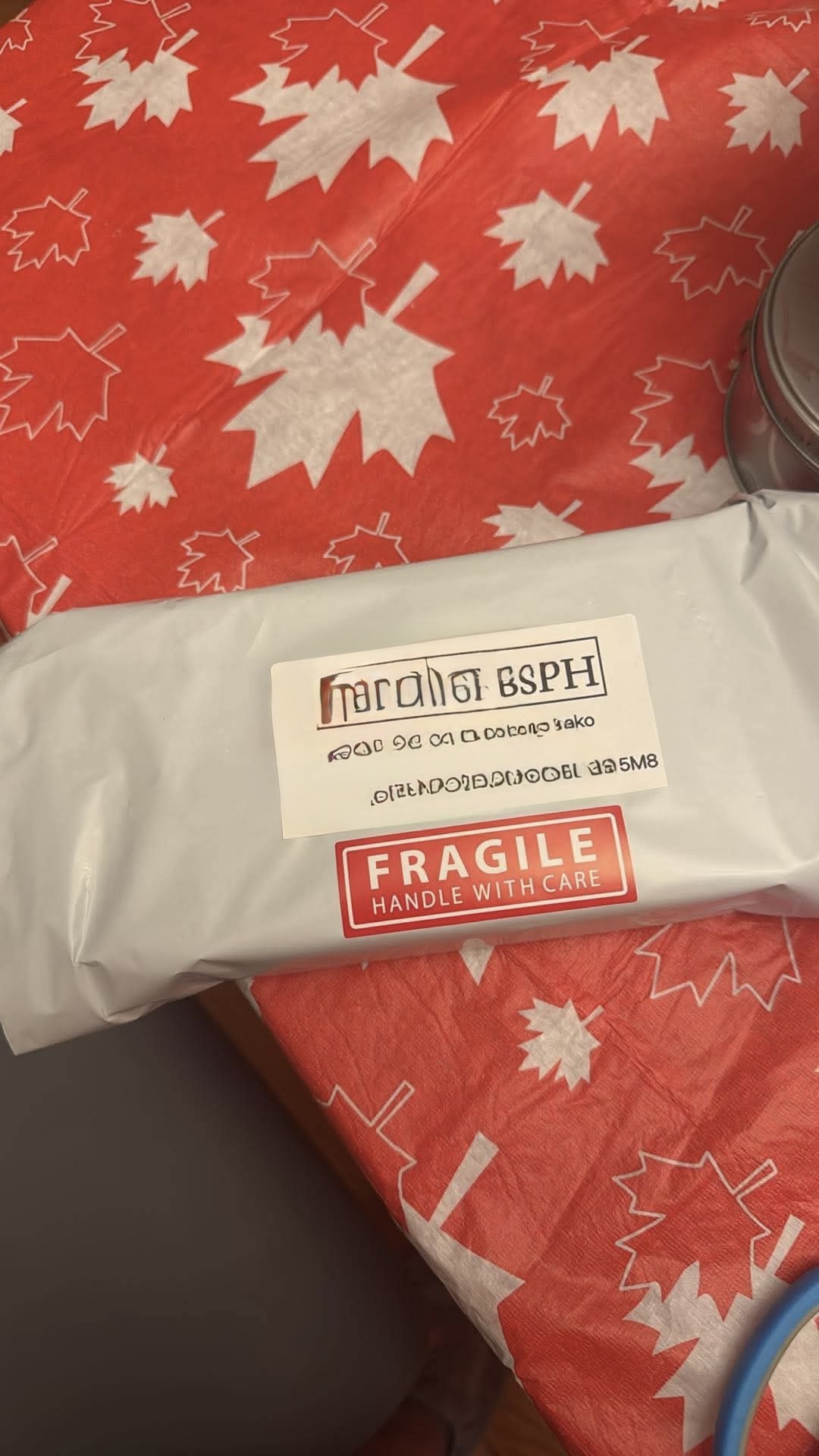FirstLabs PH mailer with fragile handle-with-care label on maple leaf tissue