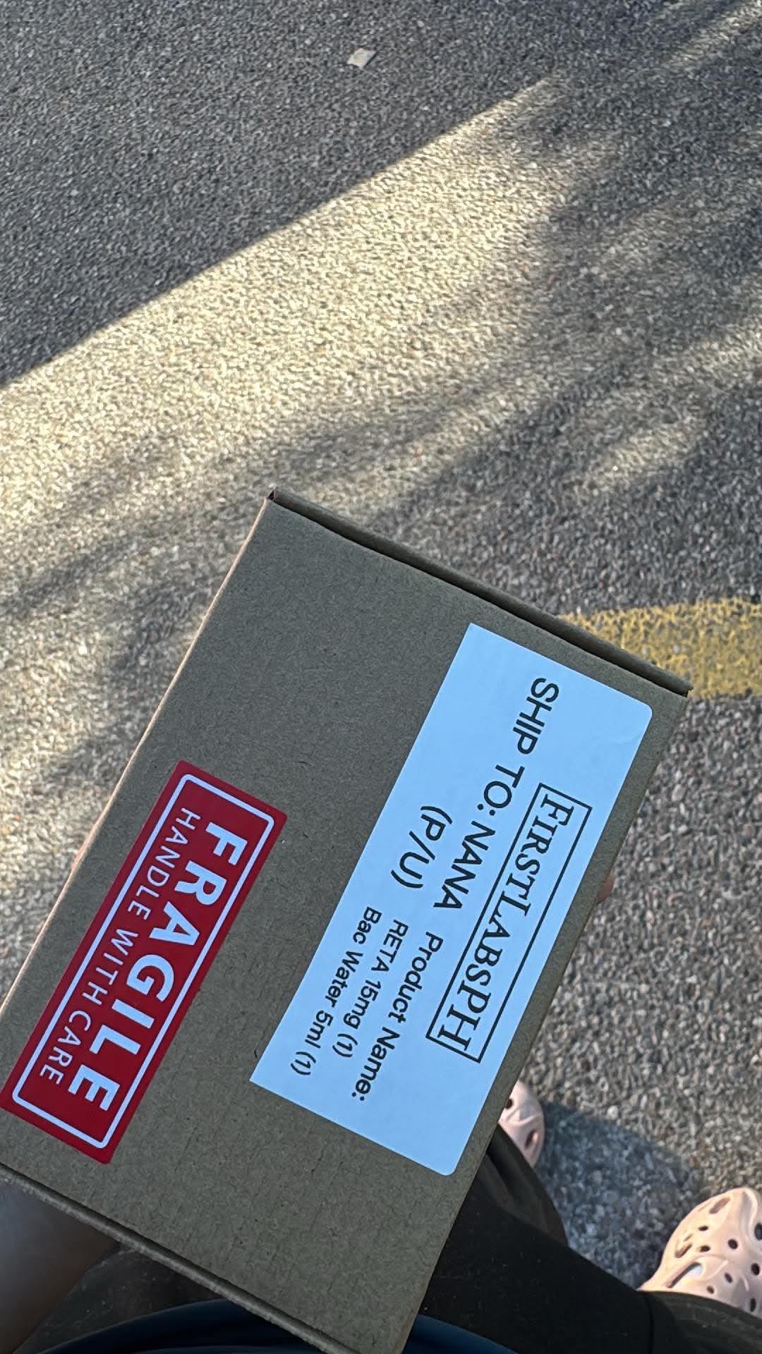 Branded FirstLabs PH shipping box with fragile label